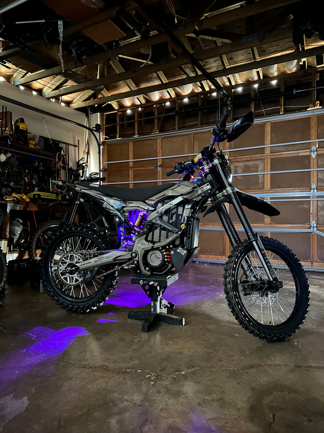 side view surron ultra bee underglow purple project 9 designs