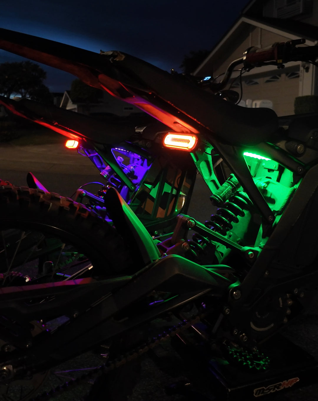 Purple and Green Surron Underglow lighting kit Project 9 Designs